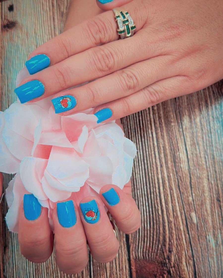 Bright blue nails with hand-painted art at Lietynails
