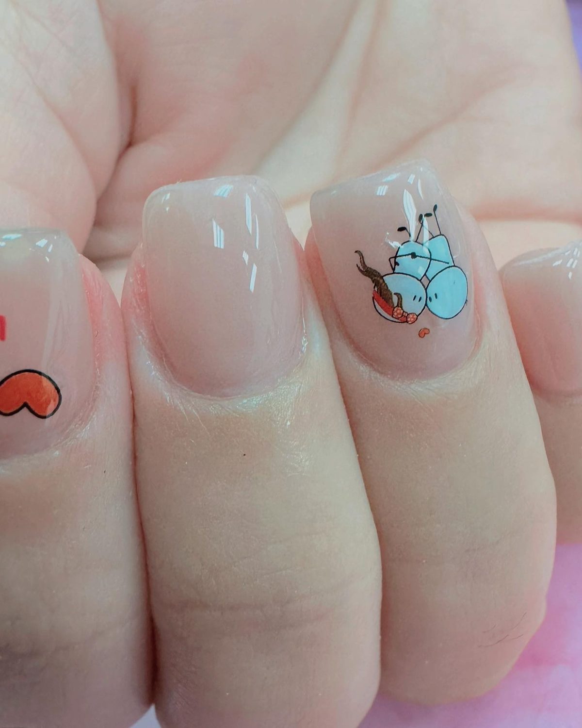 Natural gel nails with playful hand-painted art at Lietynails