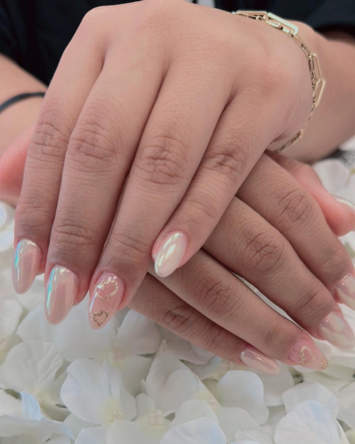 Chrome mirror-effect nails with gold heart details at Lietynails